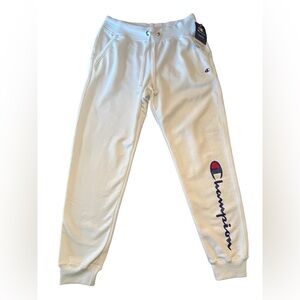 NWT- women’s white fleece Champion sweatpants in size medium.